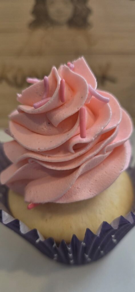 Close-up of cupcakes topped with pink bubble gum buttercream swirls
