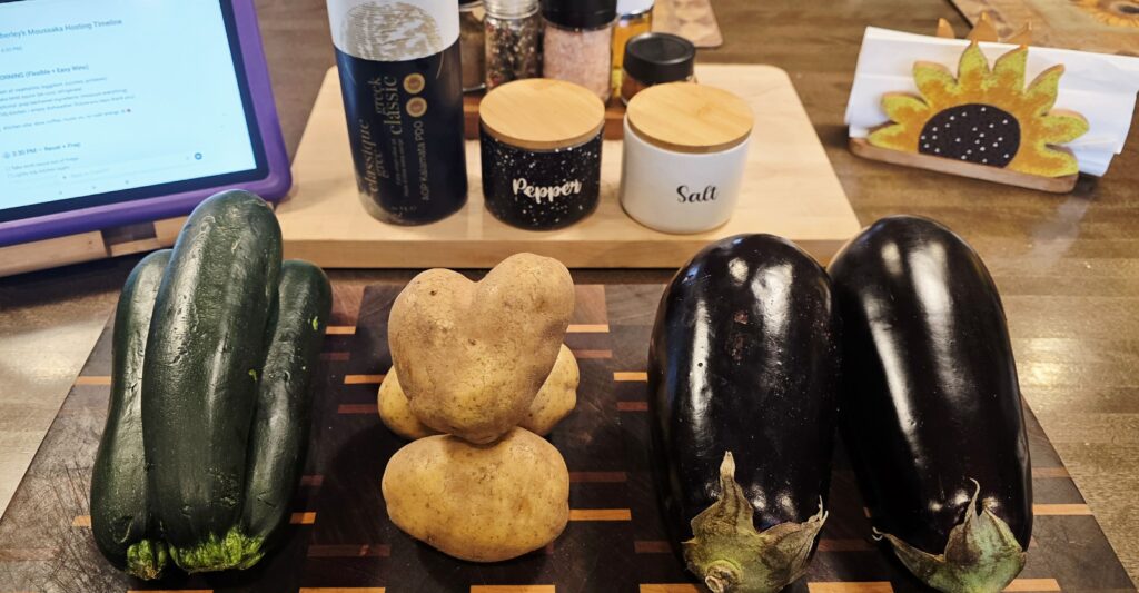Fresh eggplant, zucchini, and potatoes prepared as ingredients for vegetarian moussaka