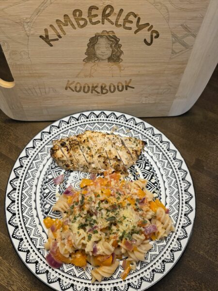 Simple garden pasta with garlic, tomatoes, peppers, and grilled garlic herb chicken