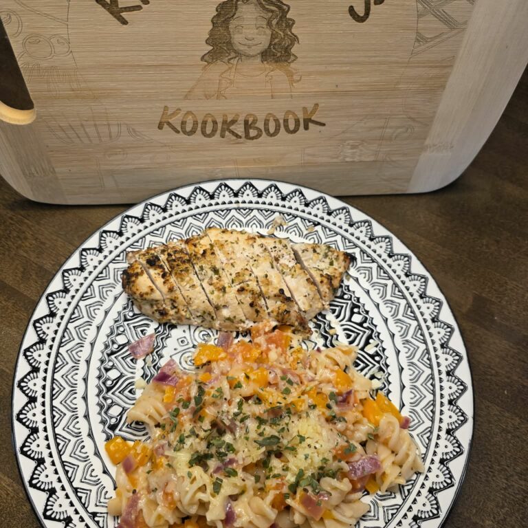 Simple garden pasta with garlic, tomatoes, peppers, and grilled garlic herb chicken
